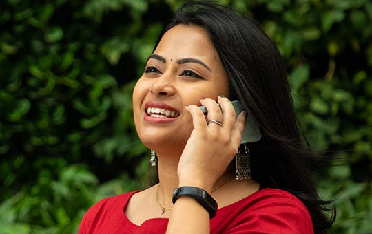 Woman talking on the phone while outside